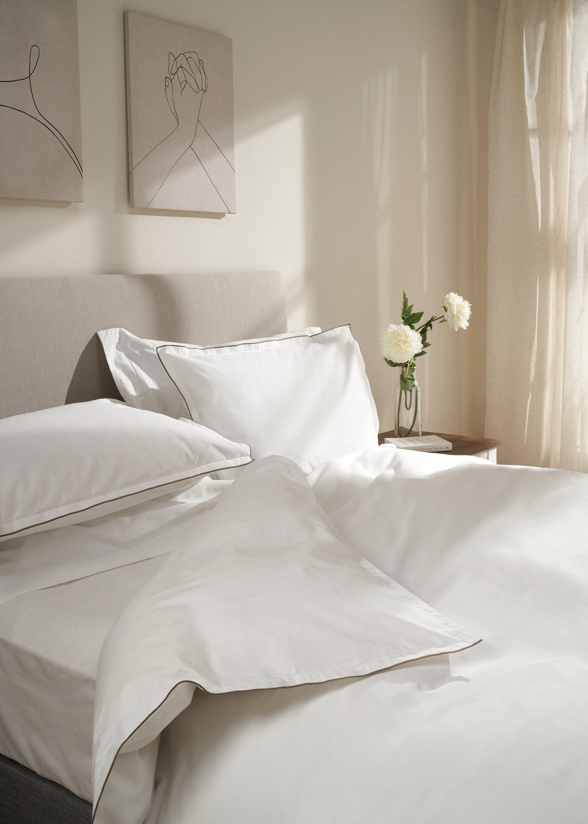 TRULY LIFESTYLE WHITE EMBROIDERED EDGE PILLOWCASES ON BED