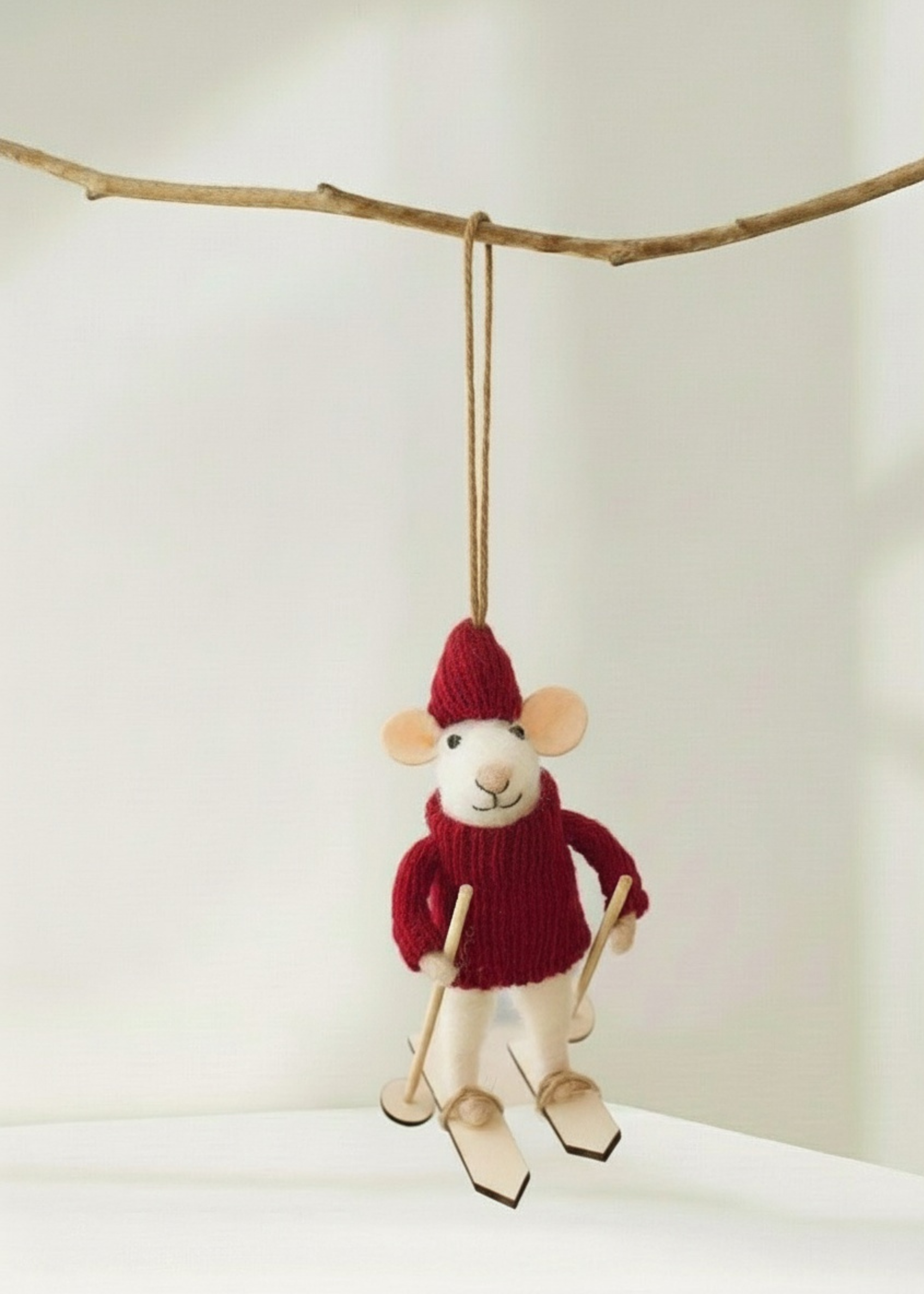 truly lifestyle Stuffed mouse christmas decoration wearing a red sweater and hat, hanging from a branch against a white background