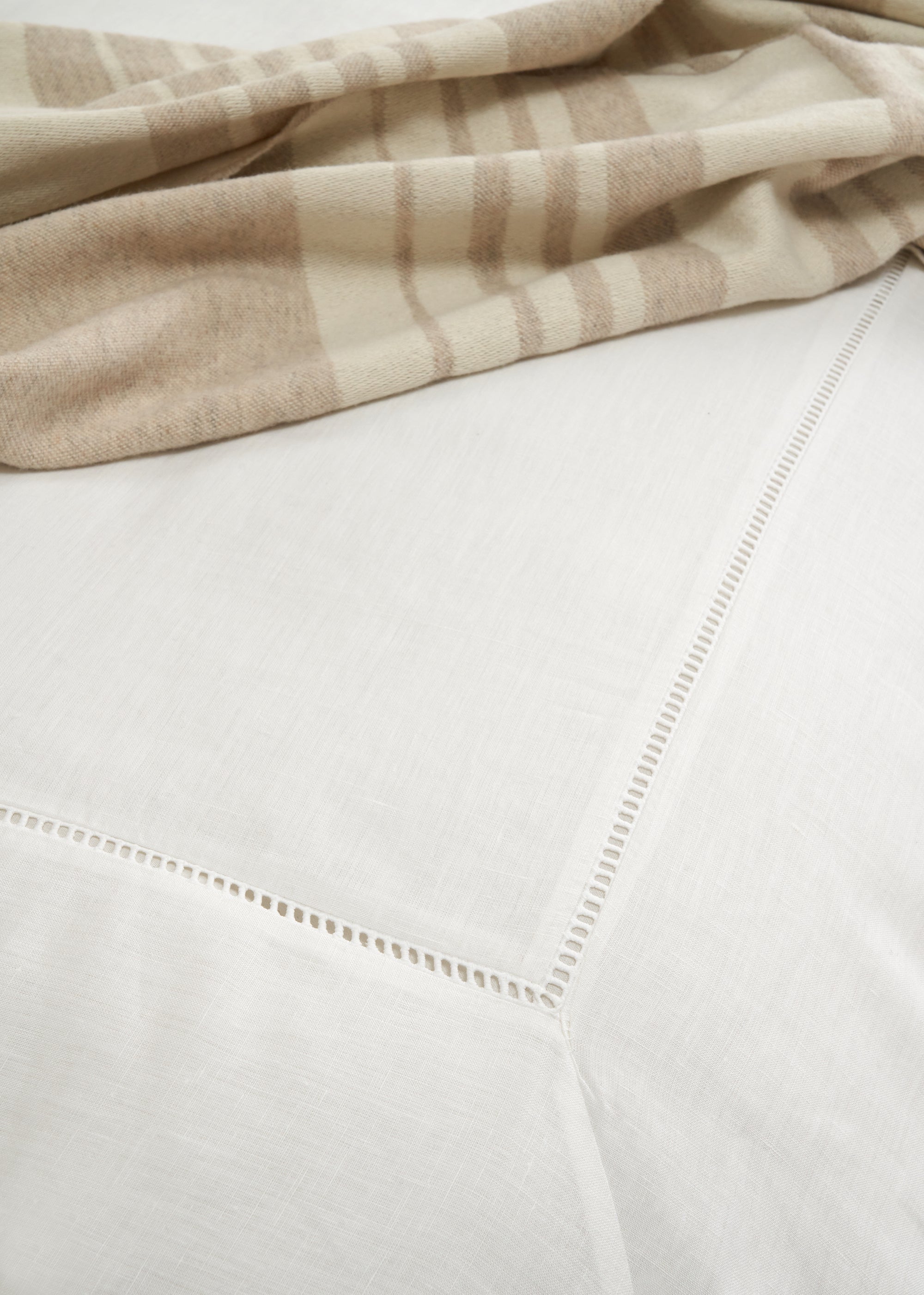 TRULY LIFESTYLE WHITE LADDER LINEN DUVET COVER ON BED CLOSE UP