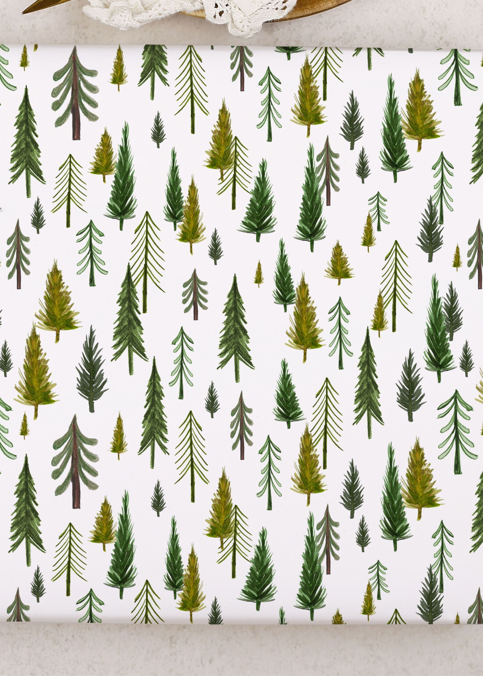 TRULY LIFESTYLE GREEN FOREST CHRISTMAS WRAPPING PAPER ON TABLE