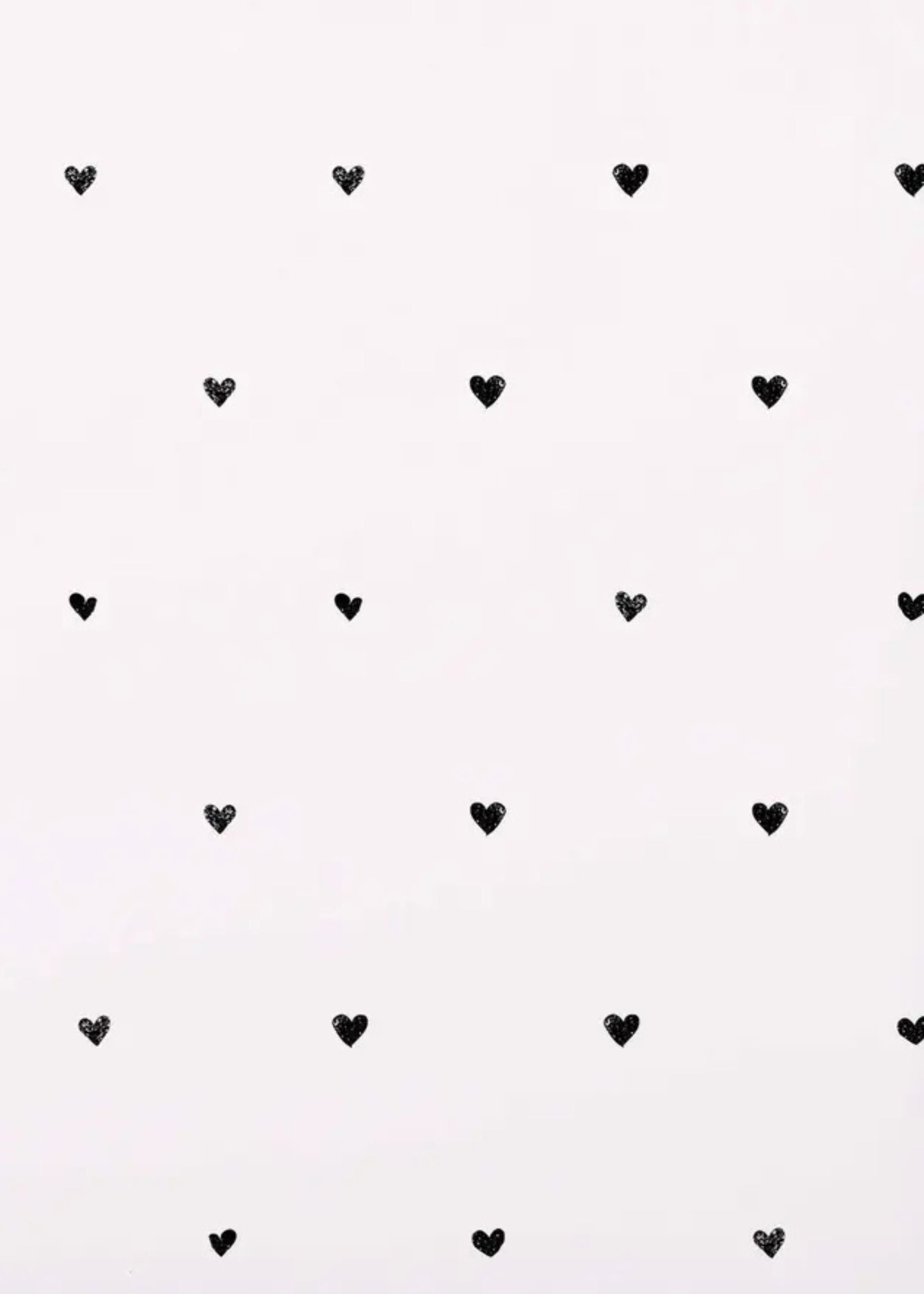 Truly Lifestyle White Wrapping paper with little black hearts on it Close up