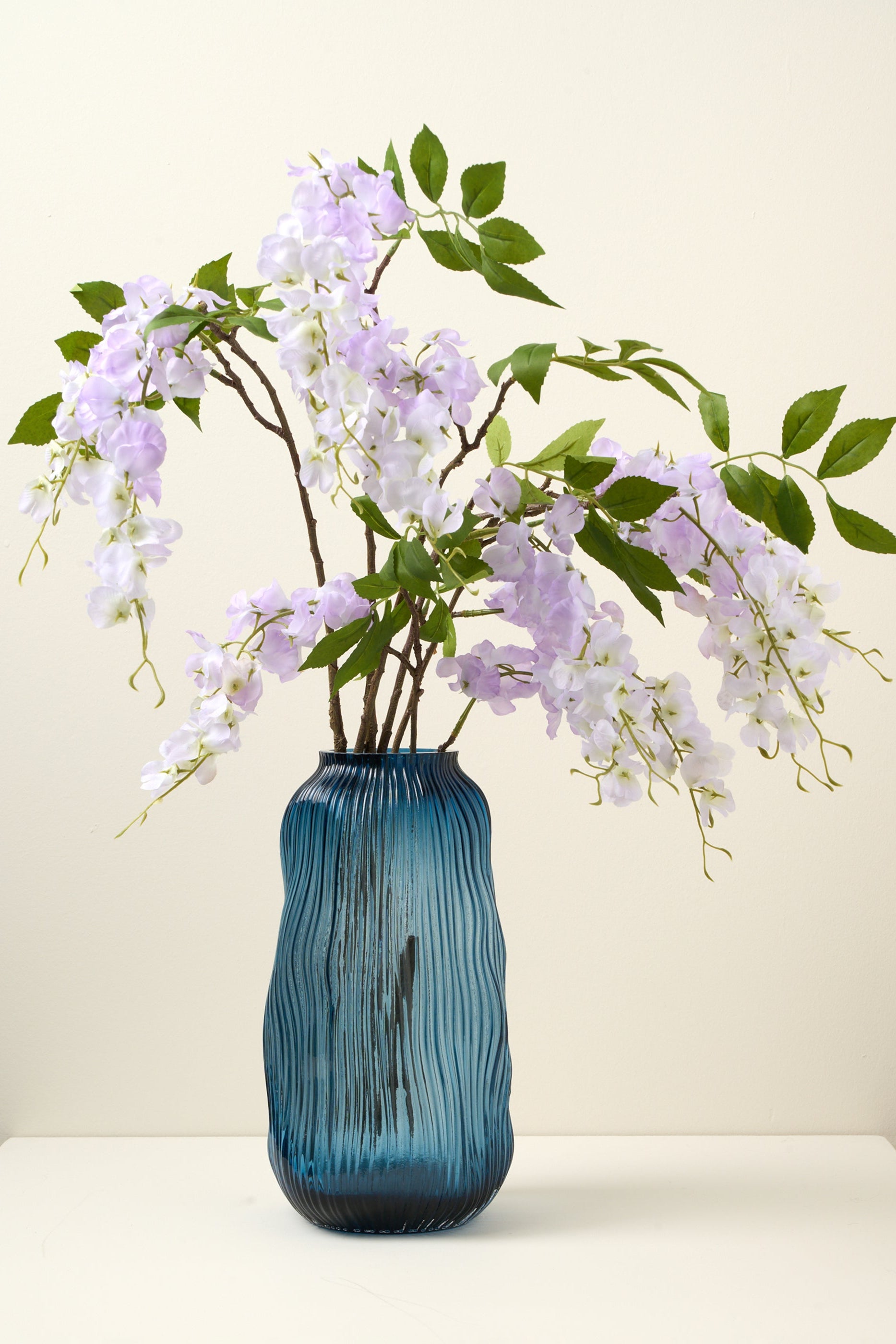 TRULY LIFESTYLE PURPLE ALLIUM SINGLE STEMS IN BLUE VASE
