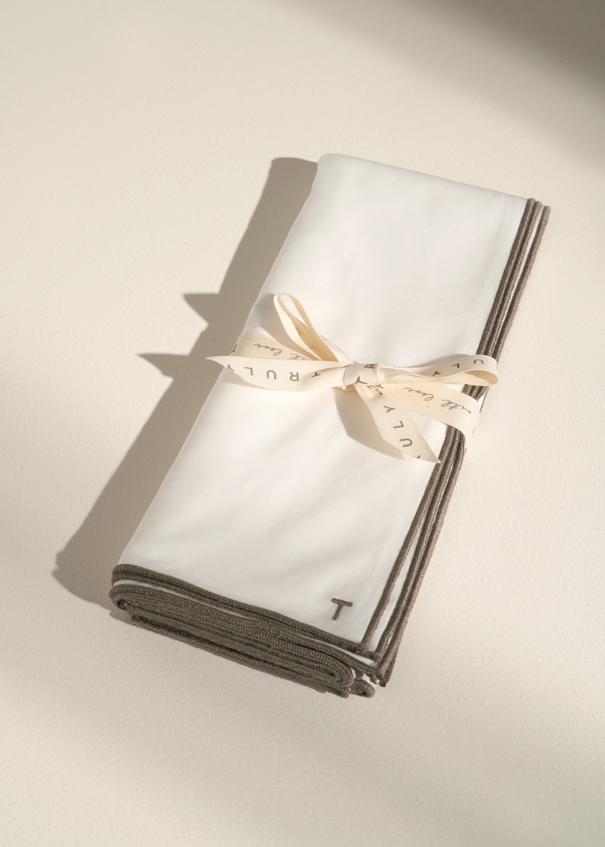 TRULY LIFESTYLE EMBROIDERED EGDE WHITE NAPKIN FOLDED