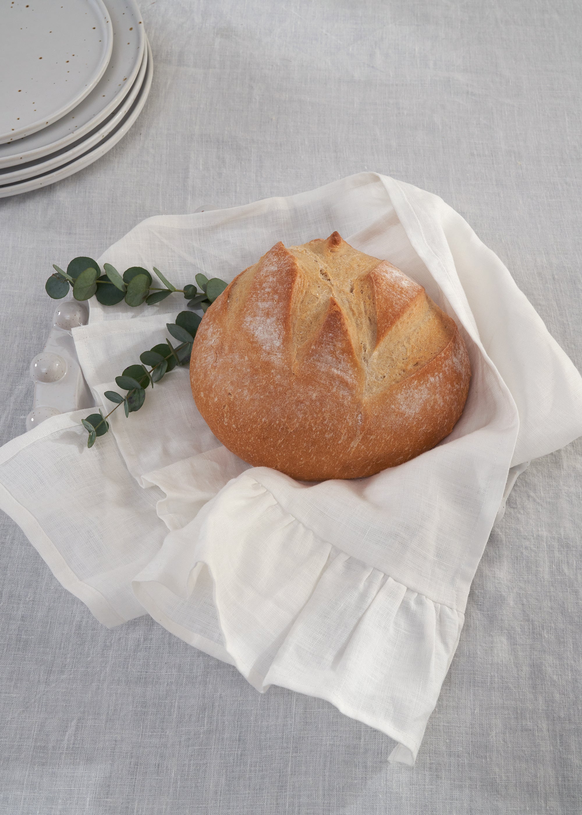 truly lifestyle white linen tea towel with fresh bread on