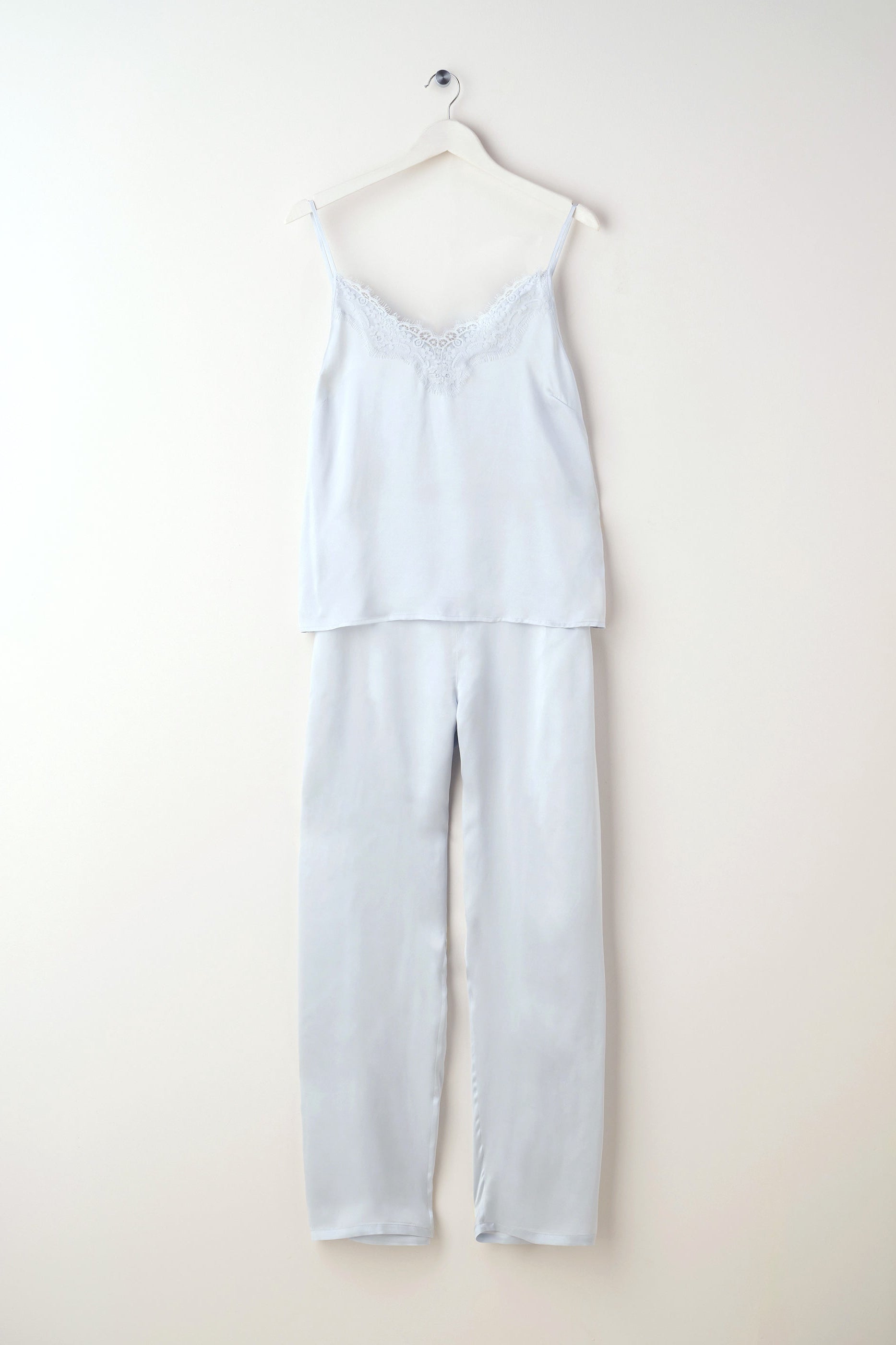 Dusty blue silk camisole and trouser set hanging | Truly Lifestyle