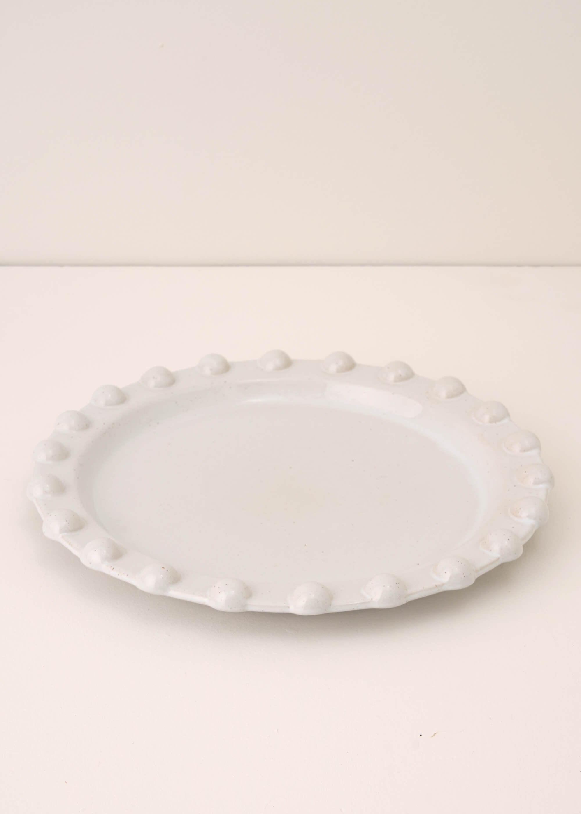 TRULY LIFESTYLE POM POM EDGED PALE GREY ROUND SERVING PLATTER
