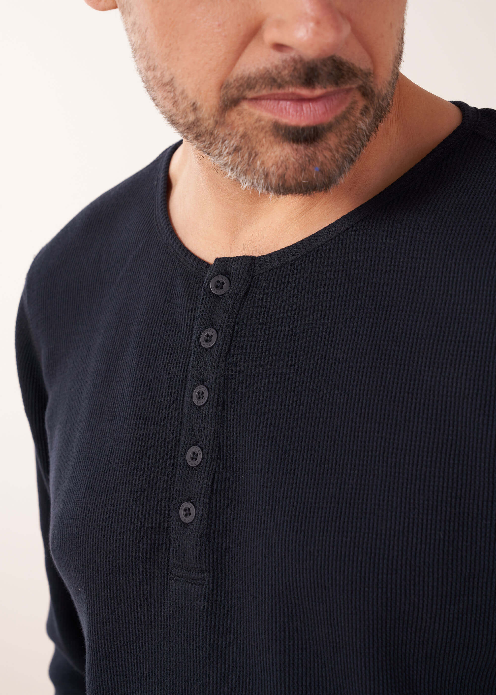 Unisex Navy Pyjama Set On Model Close Up | Truly Lifestyle