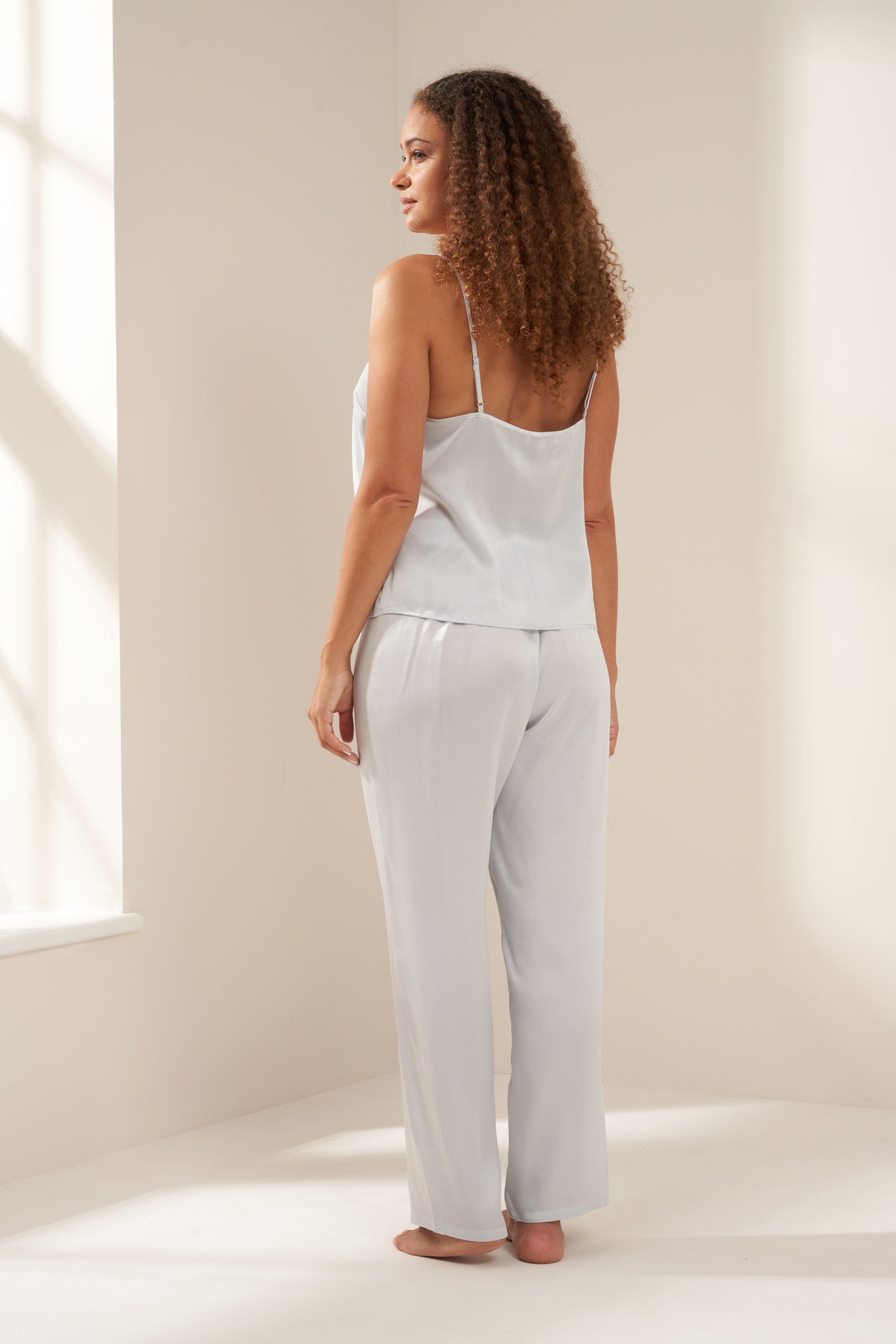 TRULY LIFESTYLE DUSTY BLUE SILK CAMISOLE AND TROUSER SET ON MODEL FROM BEHIND