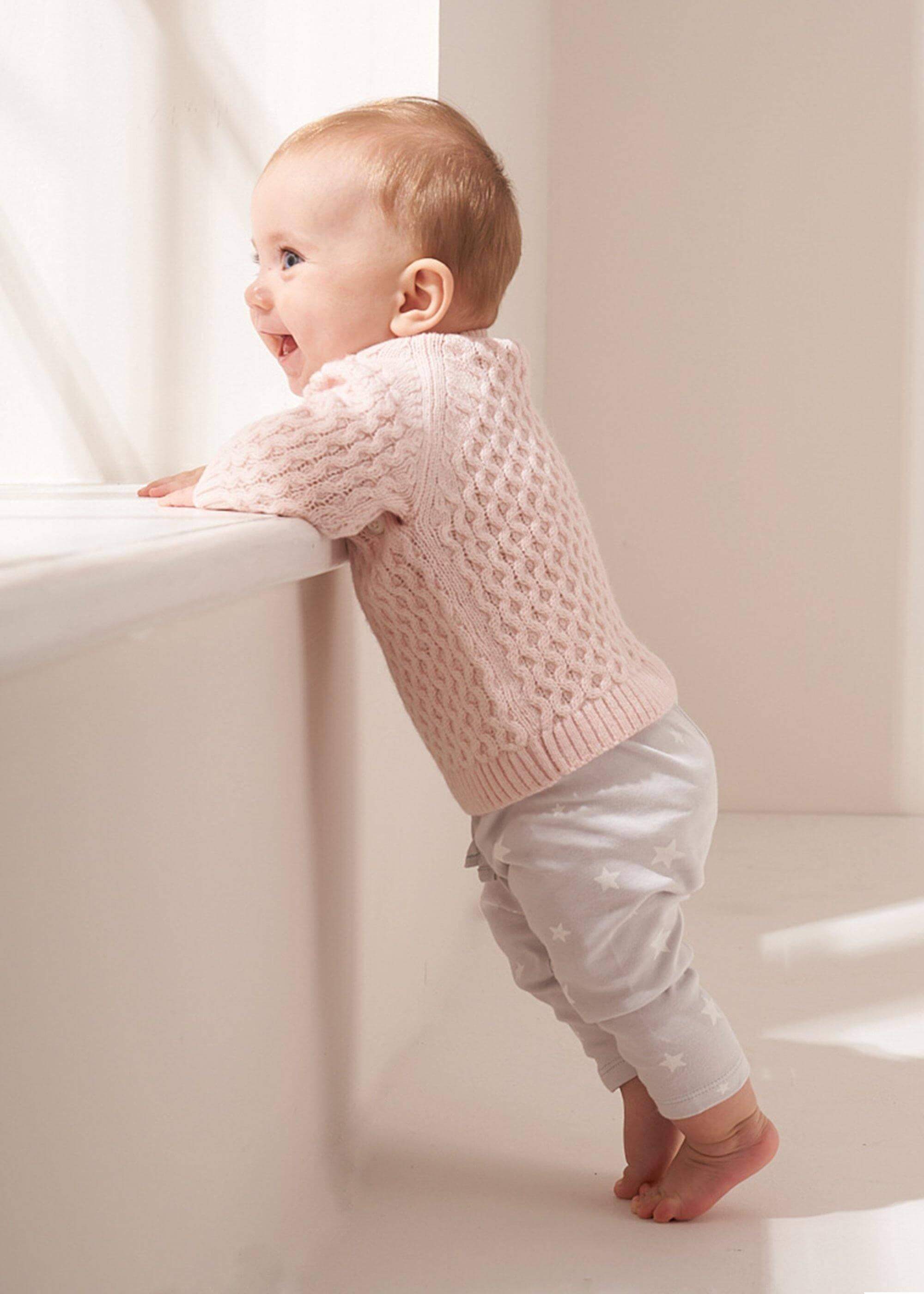 BLUSH PINK KNITTED BABY JUMPER ON A BABY | TRULY LIFESTYLE
