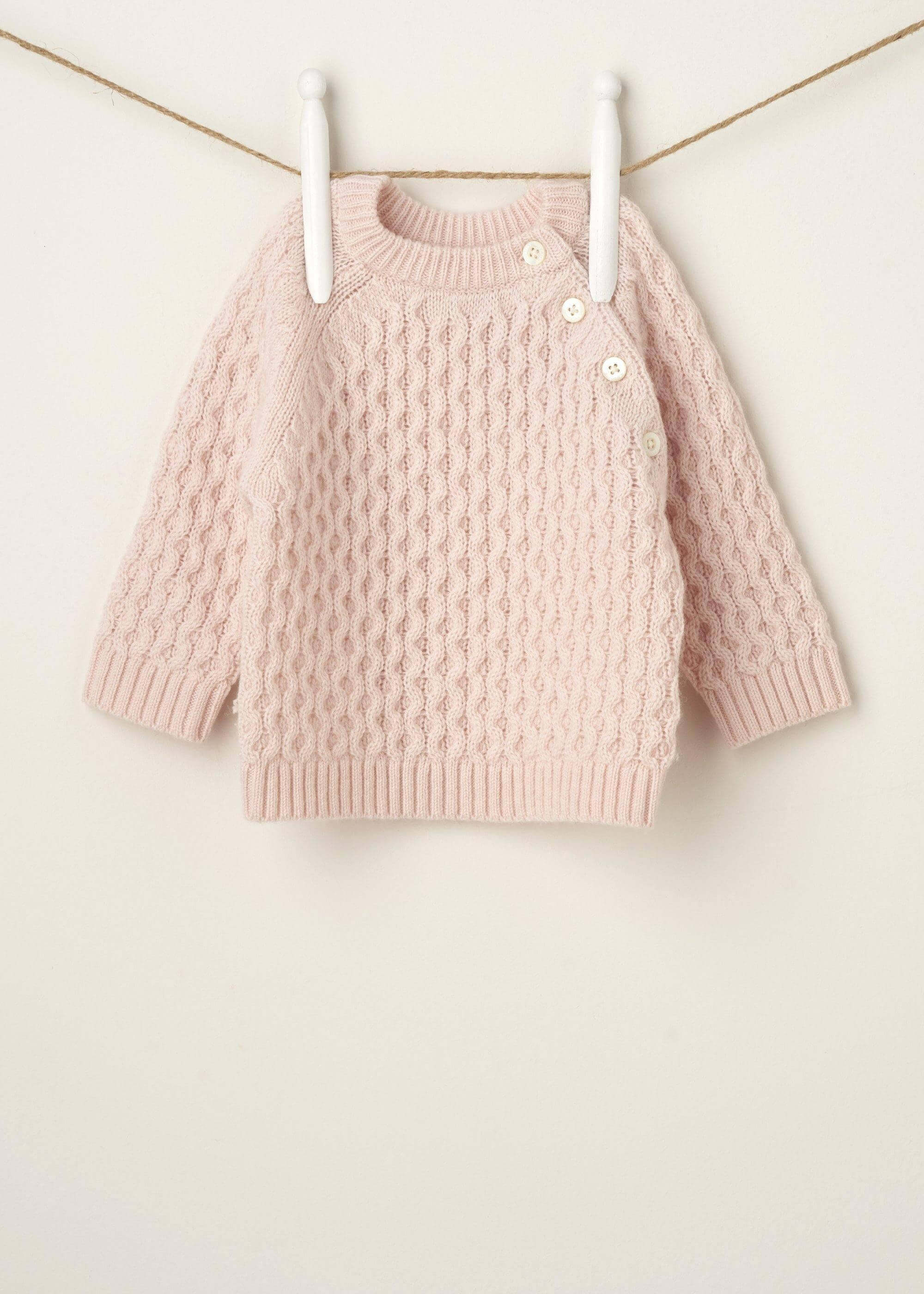 BLUSH PINK KNITTED BABY JUMPER HANGING UP | TRULY LIFESTYLE