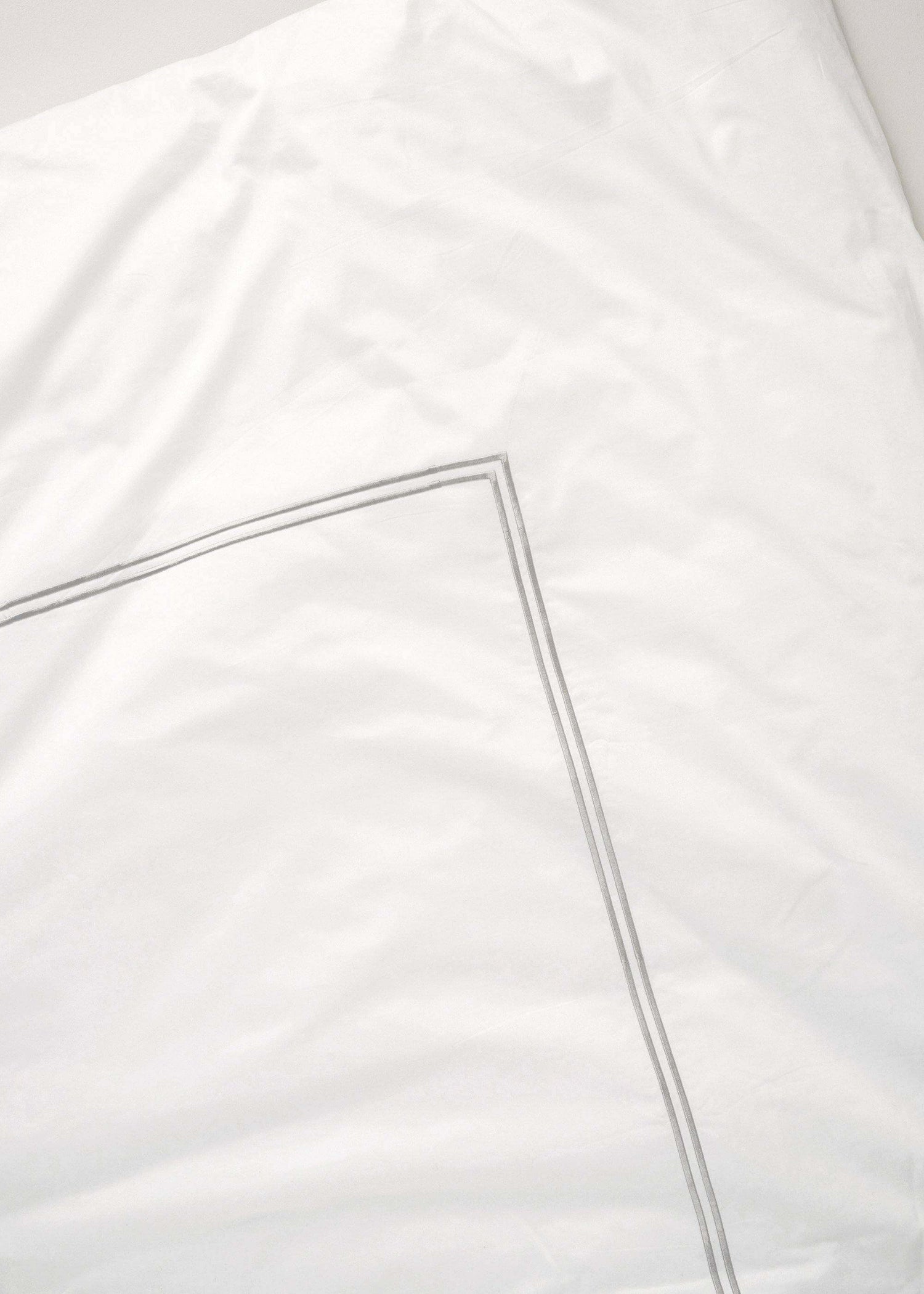 WHITE SATIN BEDDING WITH GREY STITCHING CLOSE UP | TRULY LIFESTYLE