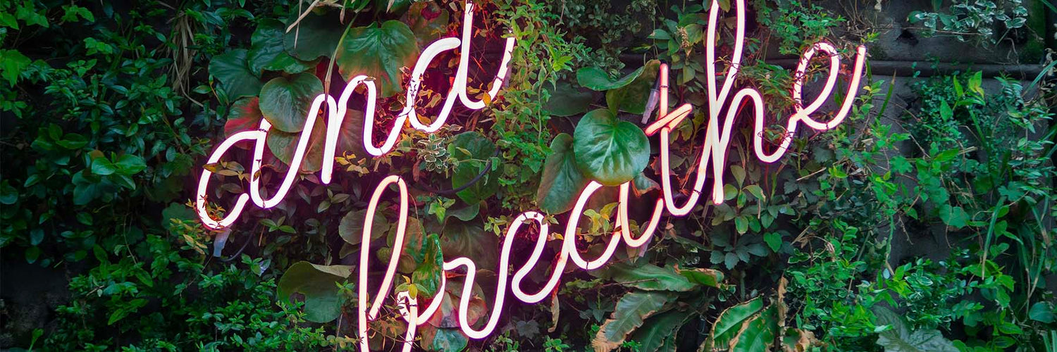 and Breathe neon sign for a journey within