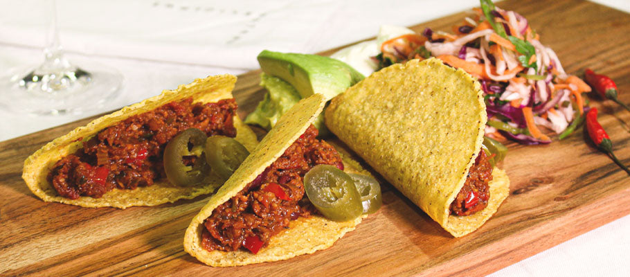 Wooden Board with Taco's and garnish