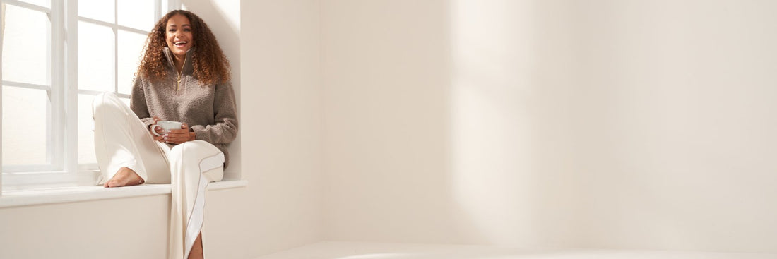 Truly Lifestyle Luxury Loungewear Banner with Model Wearing Boucle Jumper and Wide Leg Jogging Bottoms