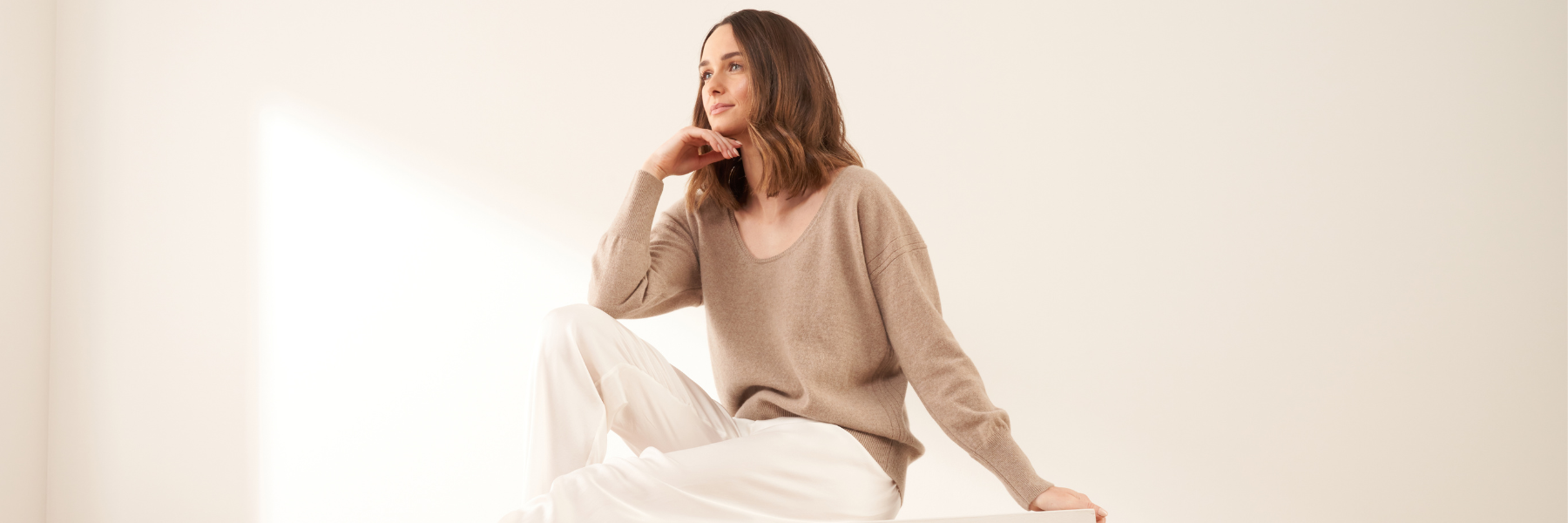 WOMENS AUTUMNAL KNITWEAR AND JUMPERS PAGE WITH WOMAN IN NUTMEG COLOURED CASHMERE JUMPER | TRULY LIFESTYLE
