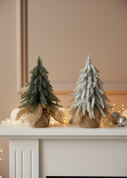 Truly Lifestyle Two small Christmas trees on a mantelpiece with decorative ribbons and lights.
