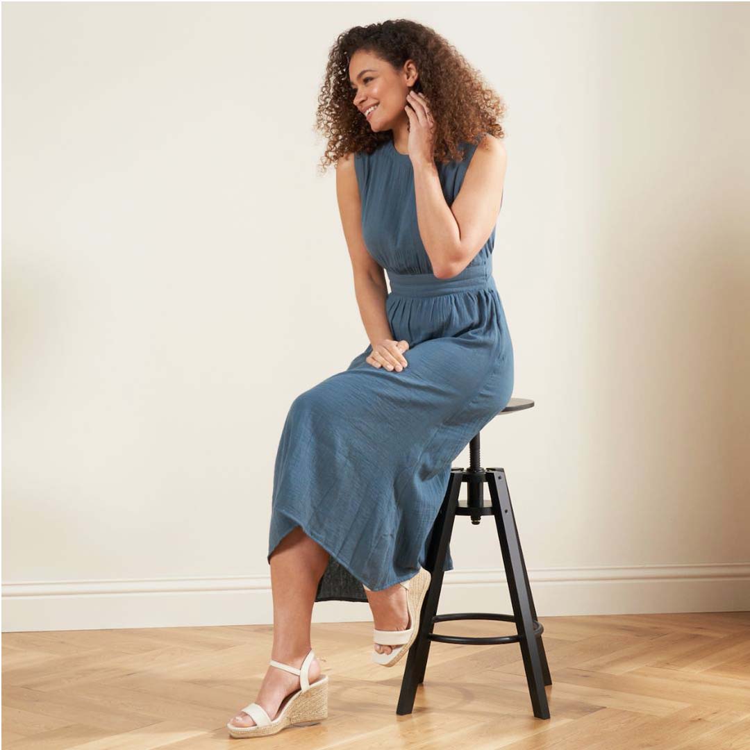 Truly Lifestyle Blue CheeseCloth Jumpsuit On Model Wearing Wedges