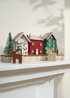 Truly Lifestyle Dark Brown Reindeer Candle with Christmas House Scene In Background