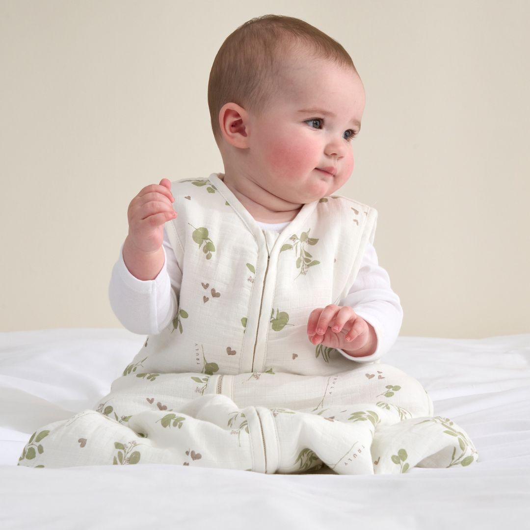 Truly Lifestyle Baby Wearing a White and Green Printed Sleeping Bag