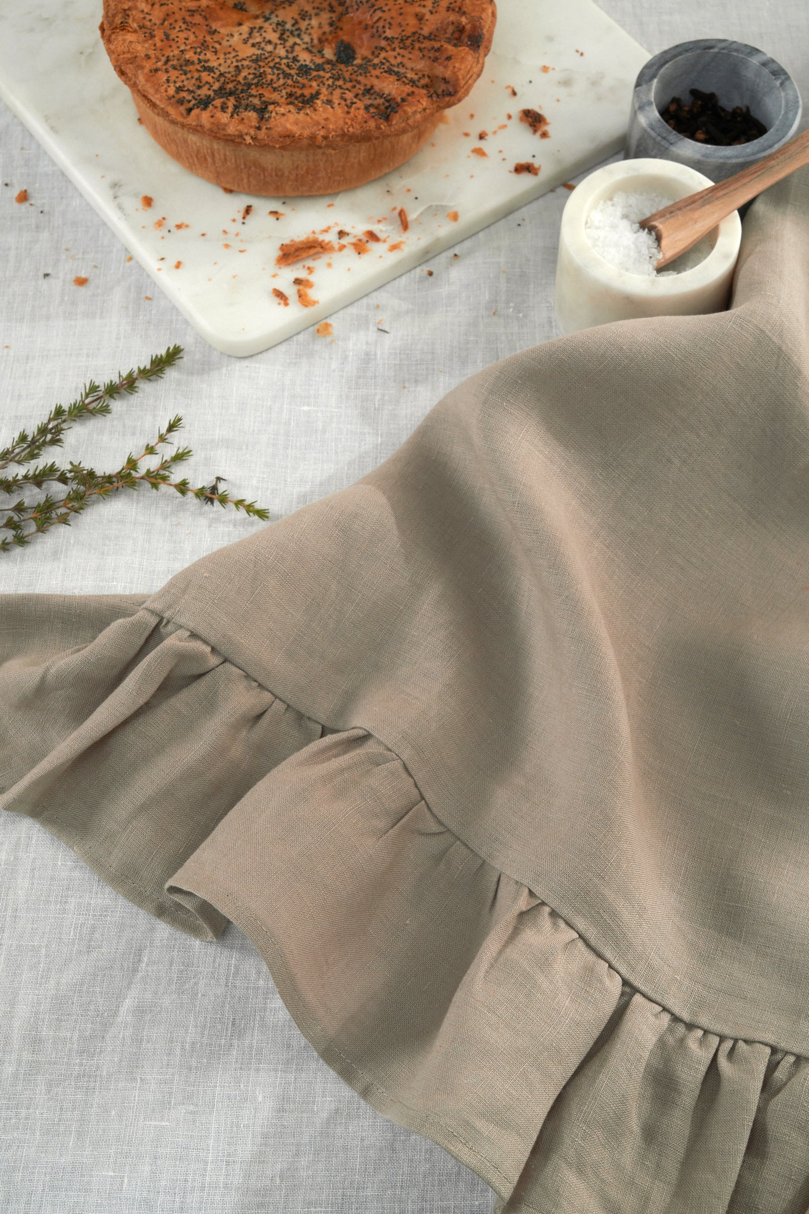 TRULY LIFESTYLE MUSHROOM LINEN COLOURED TEA TOWEL NEXT TO PINCH POTS