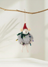 Truly Lifestyle Decorative mouse christmas decoration with a Santa hat and string lights hanging from a branch.
