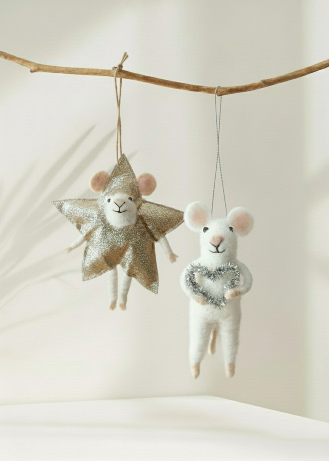Truly Lifestyle Christmas Two decorative mice, one with a star and one with a heart, hanging from a branch against a neutral background.