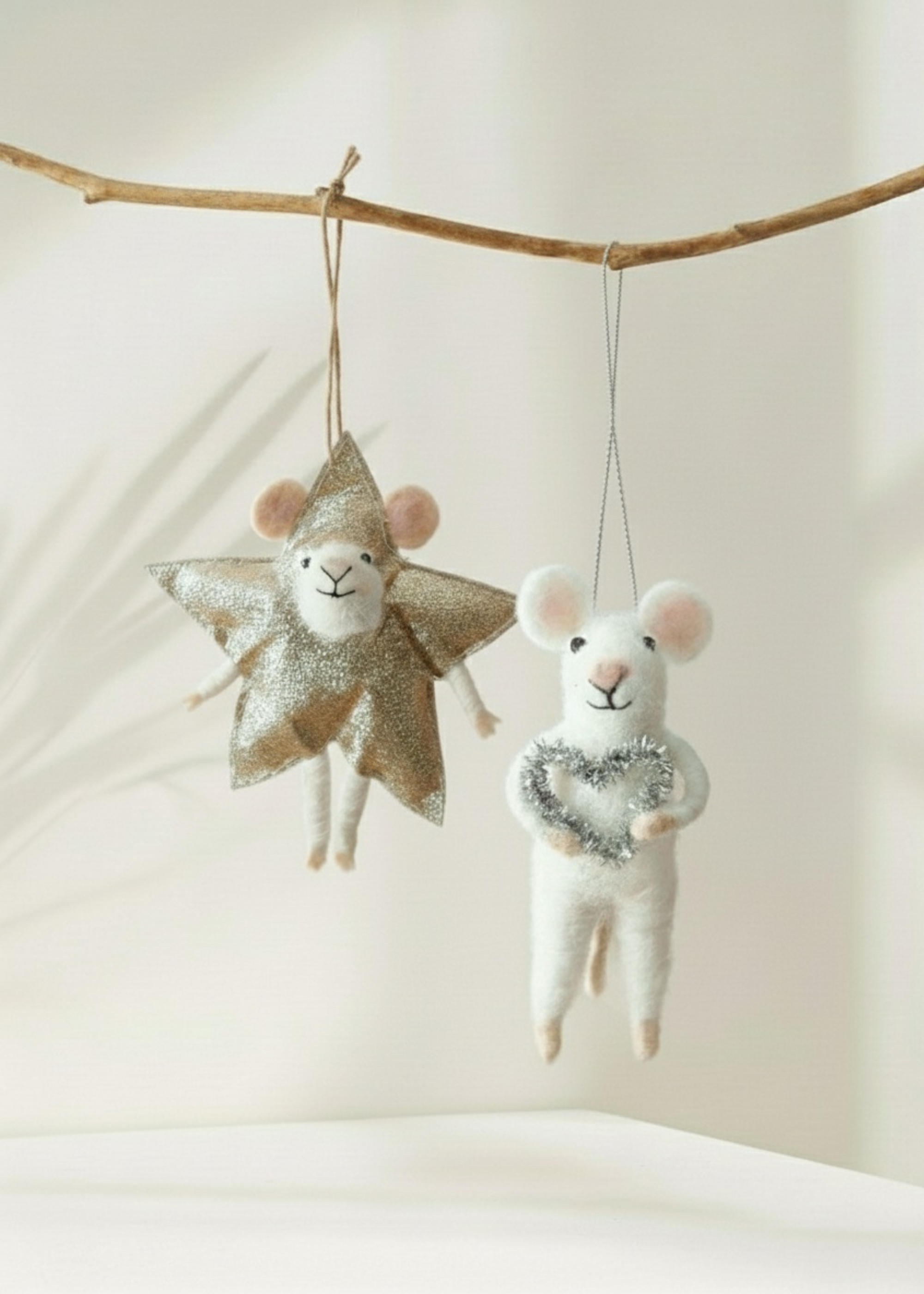 Truly Lifestyle Christmas Two decorative mice, one with a star and one with a heart, hanging from a branch against a neutral background.
