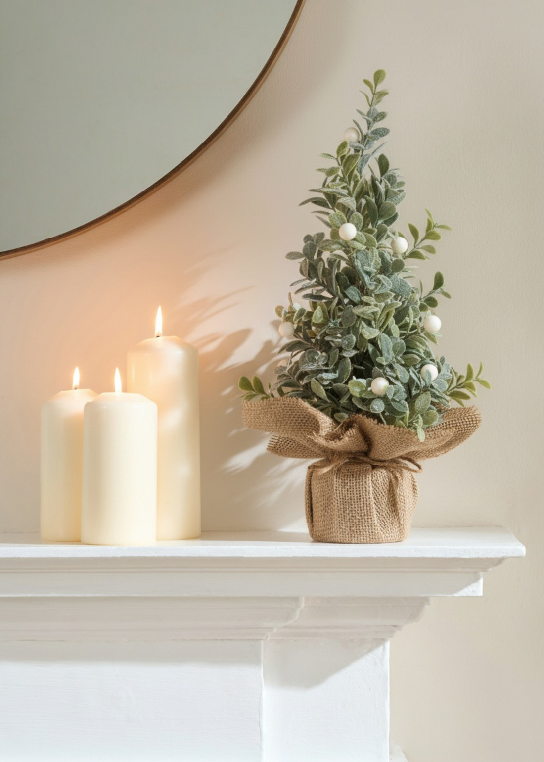 truly lifestyle eucalyptus christmas tree next to candles
