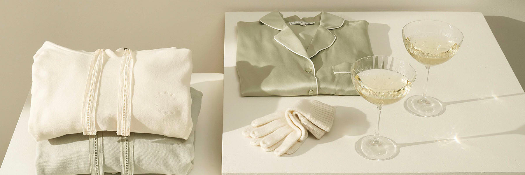 Truly Lifestyle Gifting Banner with Sage Green Silk Pyjamas and Crystal Champagne Coupes