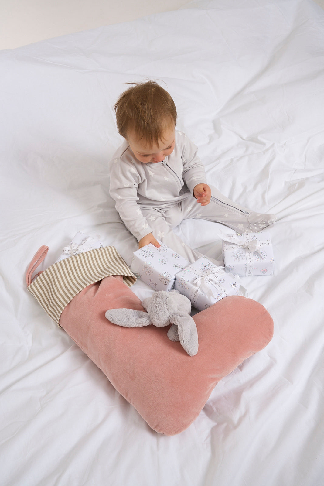 Baby with Presents and Blush Velvet Christmas Stocking 