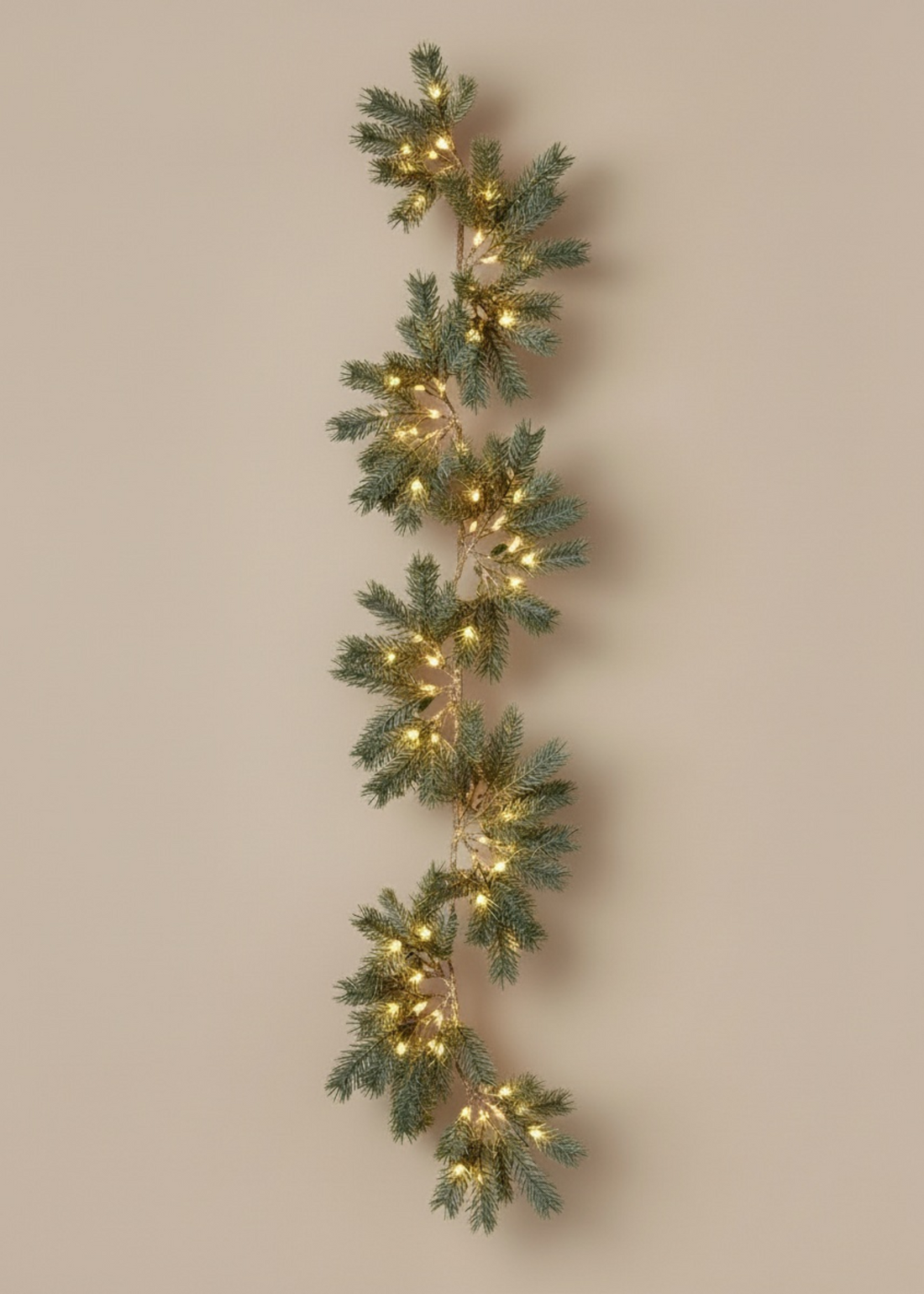 TRULY LIFESTYLE Decorative Christmas garland with lights on a beige background