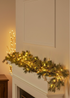TRULY LIFESTYLE LIGHT UP LED GARLAND ALONG THE FIREPLACE FOR CHRISTMAS
