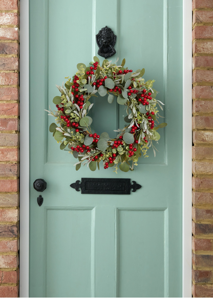 TRULY LIFESTYLE RED BERRY WREATH HANGING ON A DOOR
