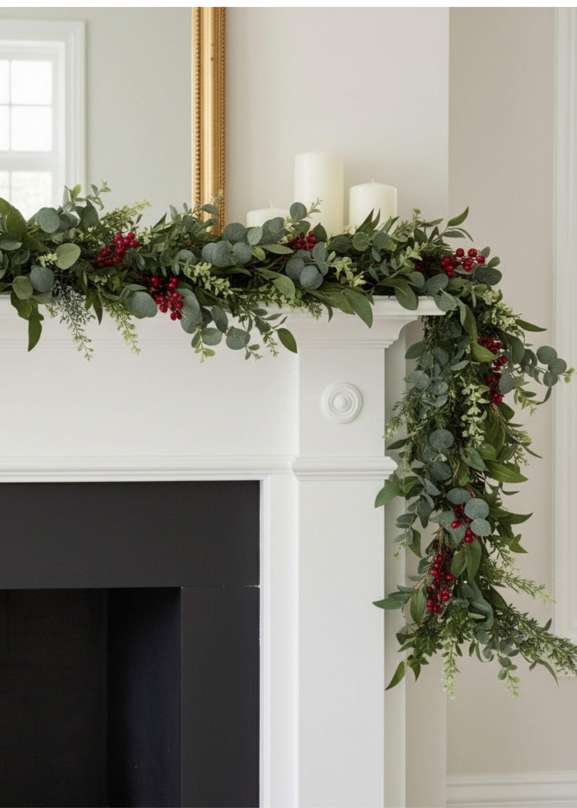 Truly Lifestyle Christmas Greenery and red berry garland on a white fireplace mantel.