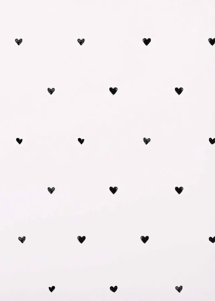 Truly Lifestyle White Wrapping paper with little black hearts on it Close up