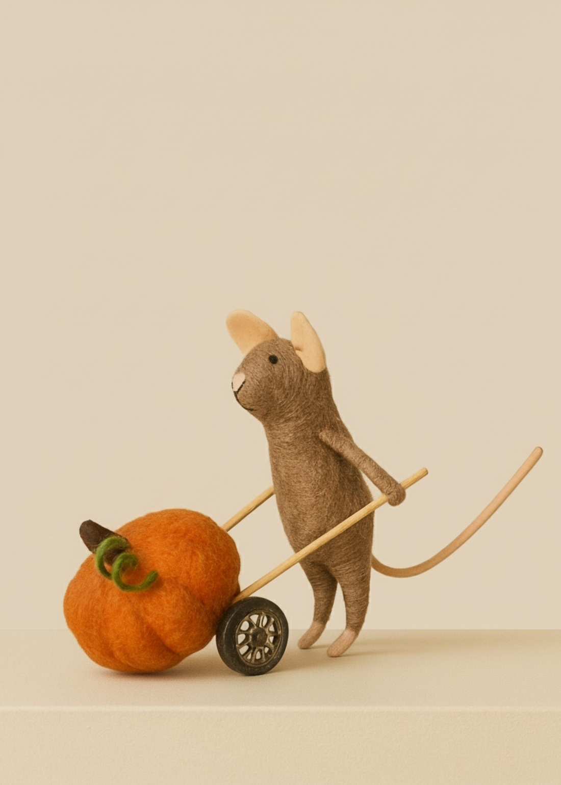 Stuffed animal with a pumpkin and cart on a beige background by Truly Lifestyle