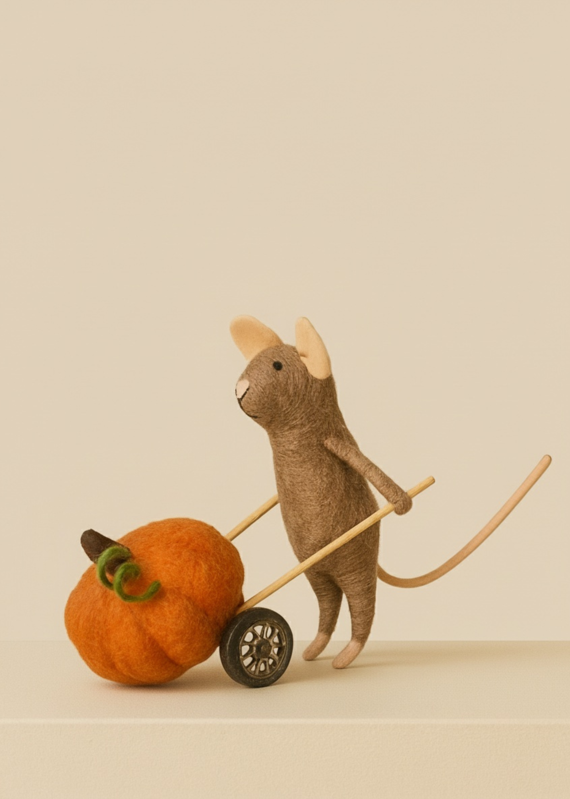 Stuffed animal with a pumpkin and cart on a beige background by Truly Lifestyle