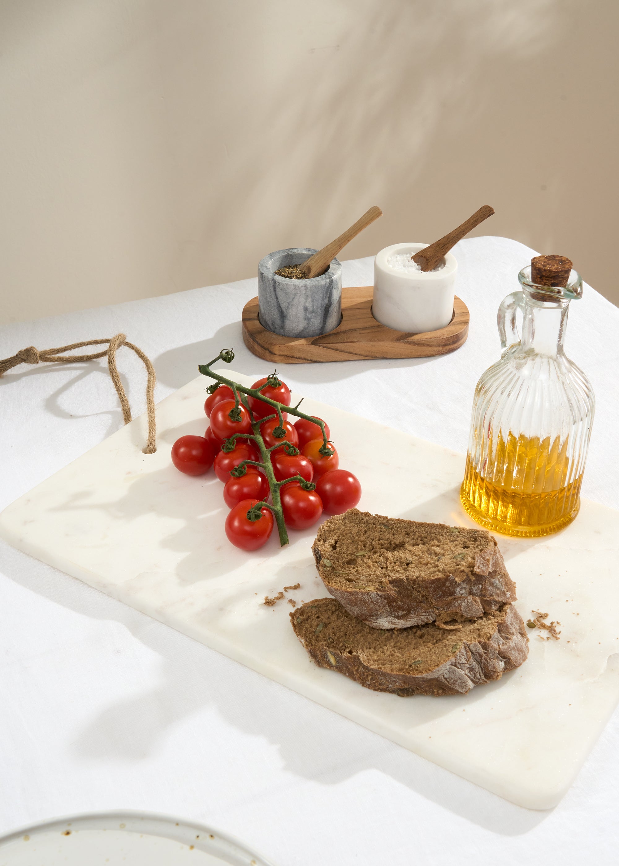 Truly Lifestyle White Marble Serving Board With Bread and Tomatoes
