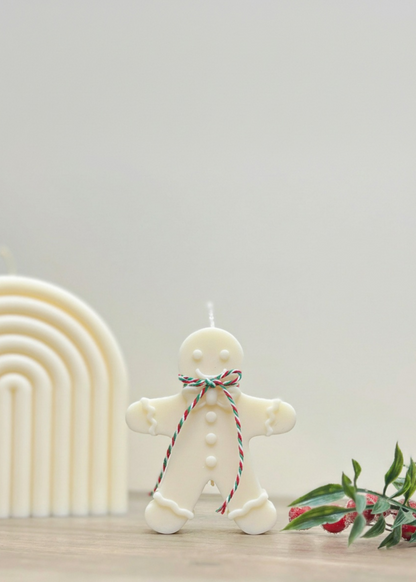 Truly Lifestyle Gingerbread man candle with a string of lights on a neutral background