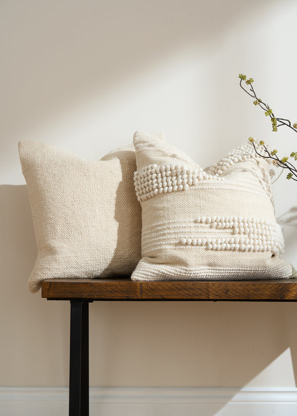 TRULY LIFESTYLE KNOTTED AND TEXTURED CREAM CUSHION ON BENCH