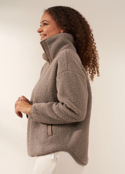 TRULY LIFESTYLE WOMENS OATMEAL BOUCLE QUARTER  ZIP JUMPER ON MODEL FROM THE SIDE WITH ECRU HAREEM JOGGING BOTTOMS