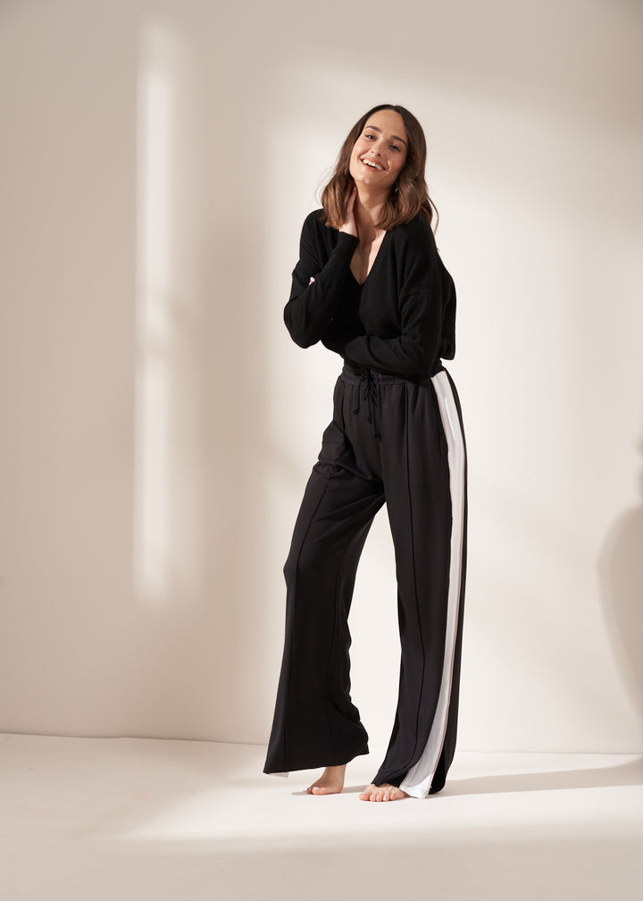 Black Bamboo Wide Legged Jogger On Model With Cashmere Jumper | Truly Lifestyle