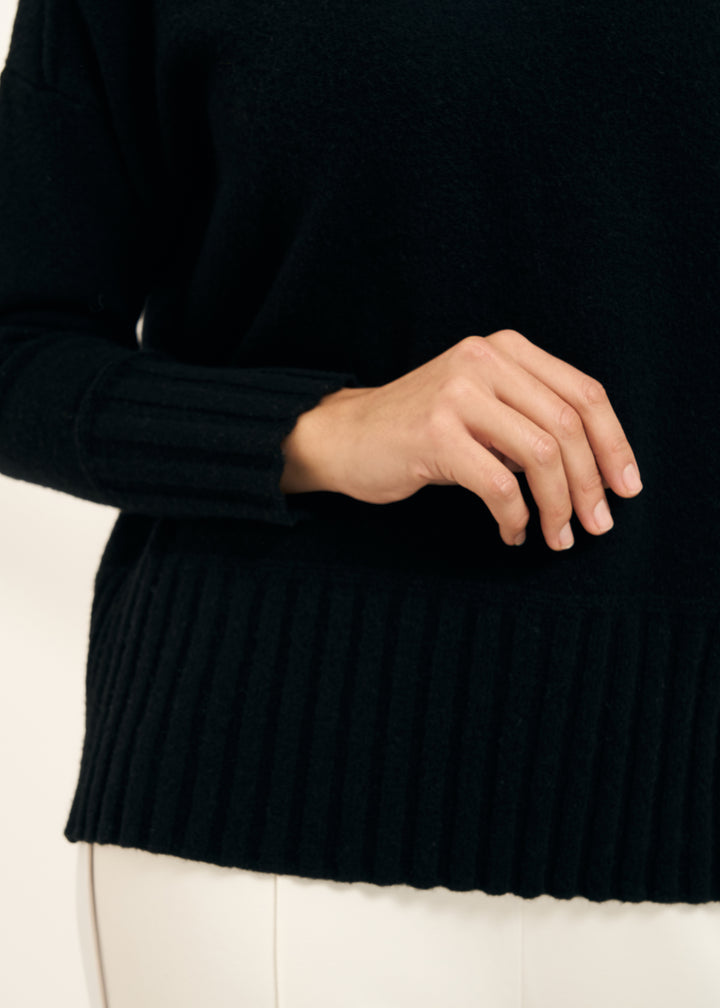 TRULY LIFESTYLE WOMENS BLACK FUNNEL NECK JUMPER WITH RIBBED HEM DETAILING CLOSE UP OF CUFF