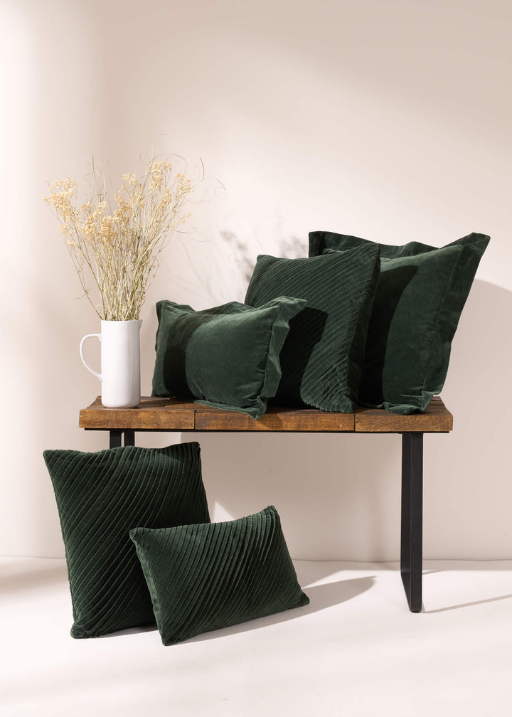 TRULY LIFESTYLE EMERALD VELVET COLLECTION OF CUSHIONS ON A BENCH WITH DRIED FLOWERS