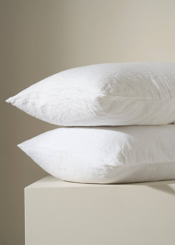 WHITE  LINEN HOUSEWIFE PILLOWCASES ON PILLOWS | TRULY LIFESTYLE