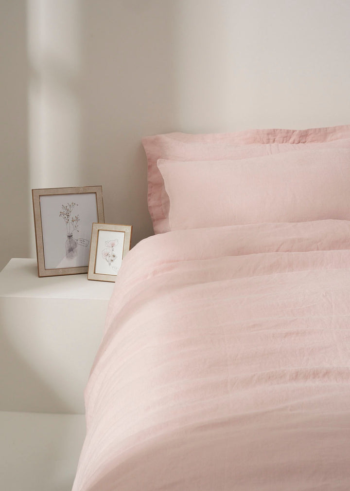 Blush Pink Linen Duvet Cover On Bed With Shagreen Photoframes | Truly Lifestyle