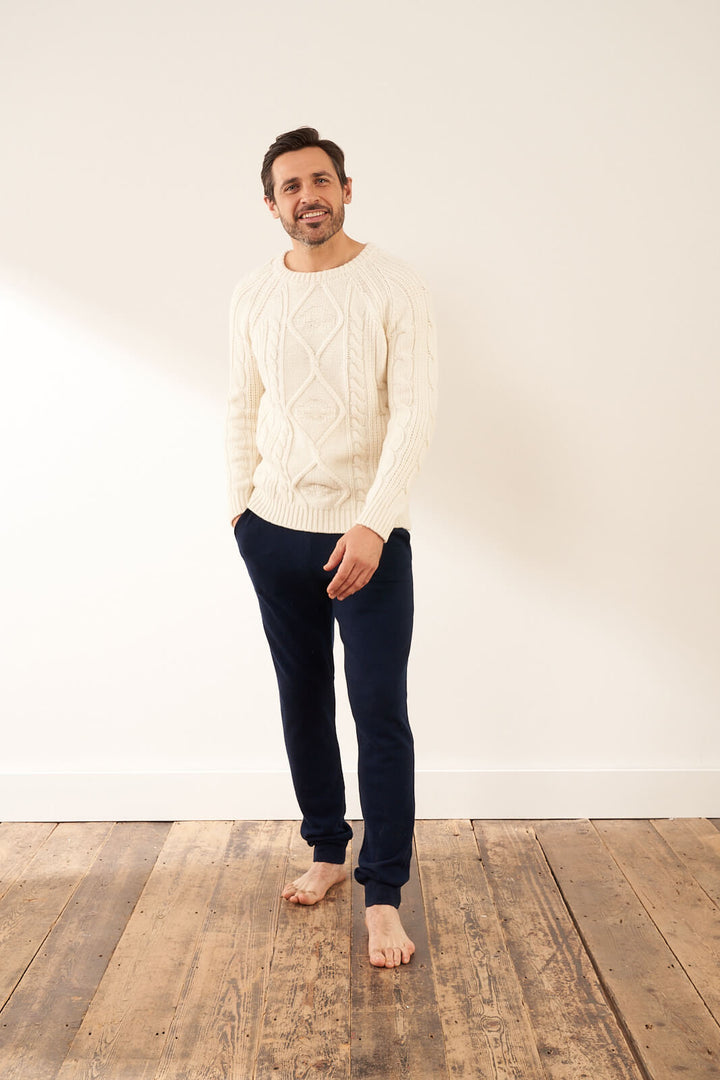 Cream Fishermans Knit Chunky Mens Jumper On Model With Cashmere Joggers| Truly Lifestyle