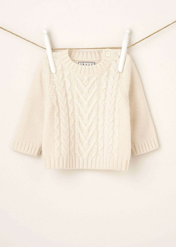 Baby Cream Cable Knit Jumper Hanging Up | Truly Lifestyle