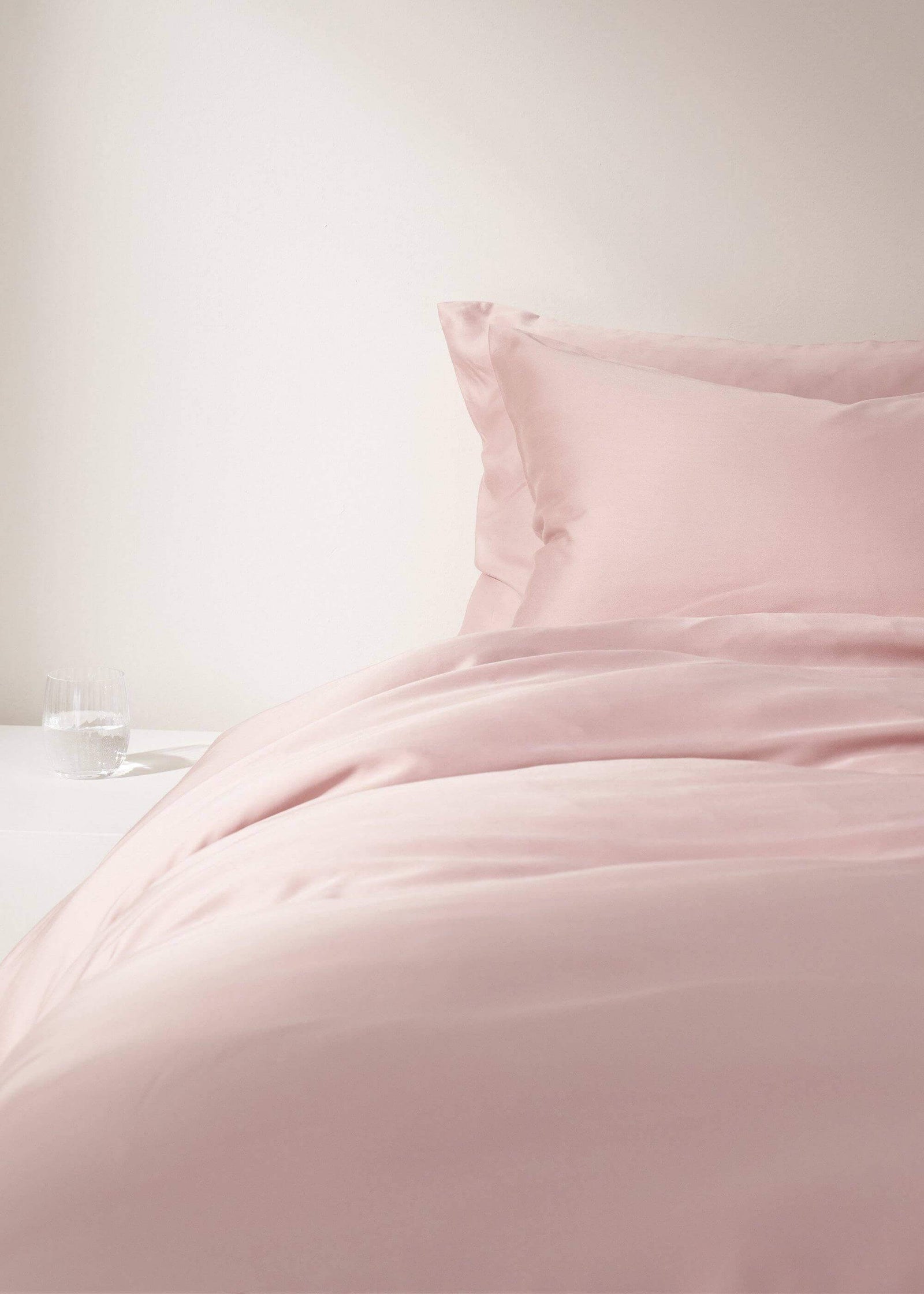 BLUSH PINK BAMBOO BEDDING SET ON BED WITH CRYSTAL GLASS | TRULY LIFESTYLE