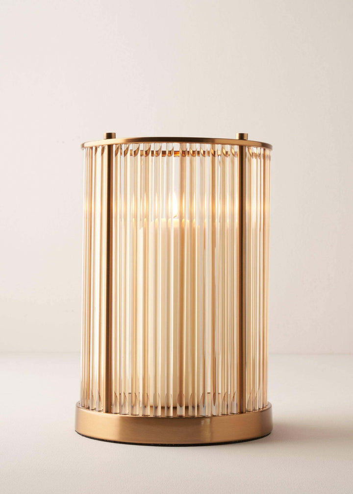 Large Brass And Glass Hurricane With Lit Candle Inside | Truly Lifestyle